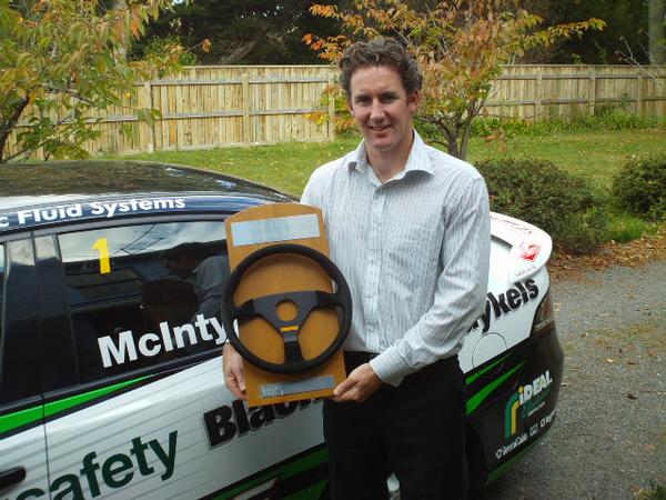 Three-time NZV8 champion John McIntyre pictured with the Ashley Stichbury Memorial Trophy presented for good sportsmanship